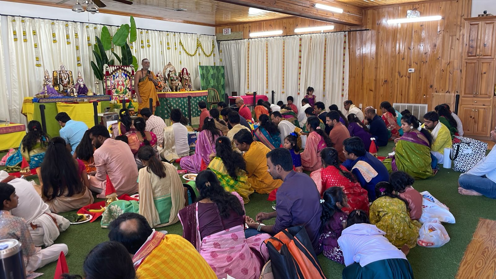 Priests guide the devotees through mantras and rituals as the auspicious Sathya Narayana Vratham takes place.